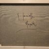 Retro del telaio in legno del quadro, che mostra la firma autografa dell'artista "G. Iannicella" e il titolo "Napoli" scritti a mano sulla tela grezza.