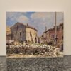Quadro Scorcio di paese olio su tela Armando Romano Dipinto olio su tela raffigurante vecchie case di campagna in pietra con un muretto a secco in primo piano e cielo nuvoloso, firmato A. Romano.