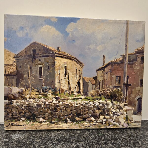 Dettaglio pennellate e prospettiva laterale dipinto Romano Vista laterale del quadro che evidenzia la texture della pittura a olio, i dettagli delle pietre del muretto e la profondità dei colori delle case rustiche.