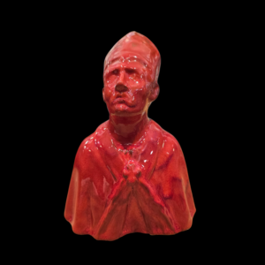 Dettaglio-Volto-San-Gennaro-Rosso Dettaglio del volto e della mitra della statuina artigianale di San Gennaro in ceramica lucida.
