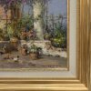 Particolare in primo piano della firma del pittore Vincenzo Laricchia ed i dettagli dei vasi da fiori nel cortile